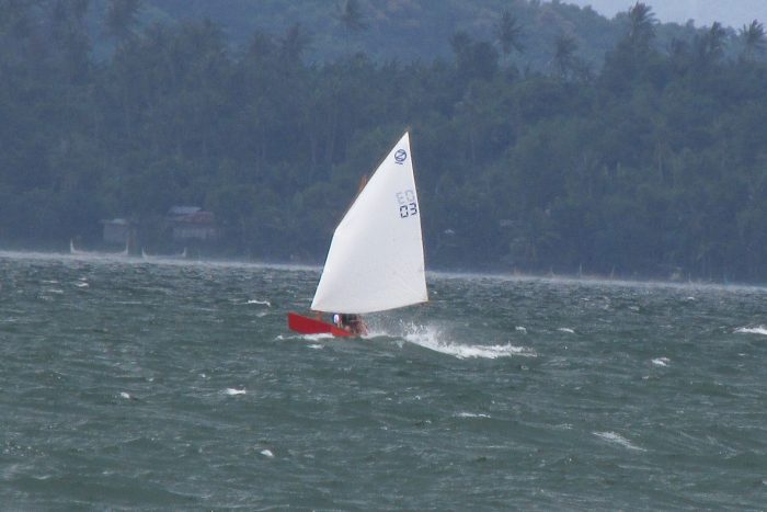 Oz Goose sailing dinghy fast sailing in waves in strong wind on Taal